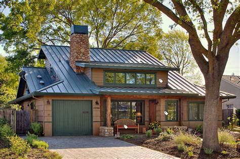 green siding house with brick and green metal roof|green brick exterior.